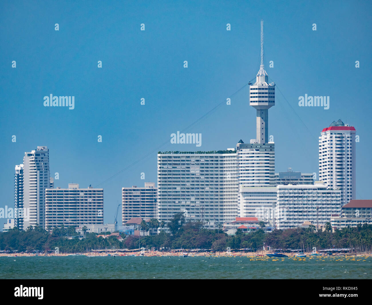 High rice buildings and the tower of Pattaya Park along Jomtien Beach in Pattaya, Thailand Stock Photo