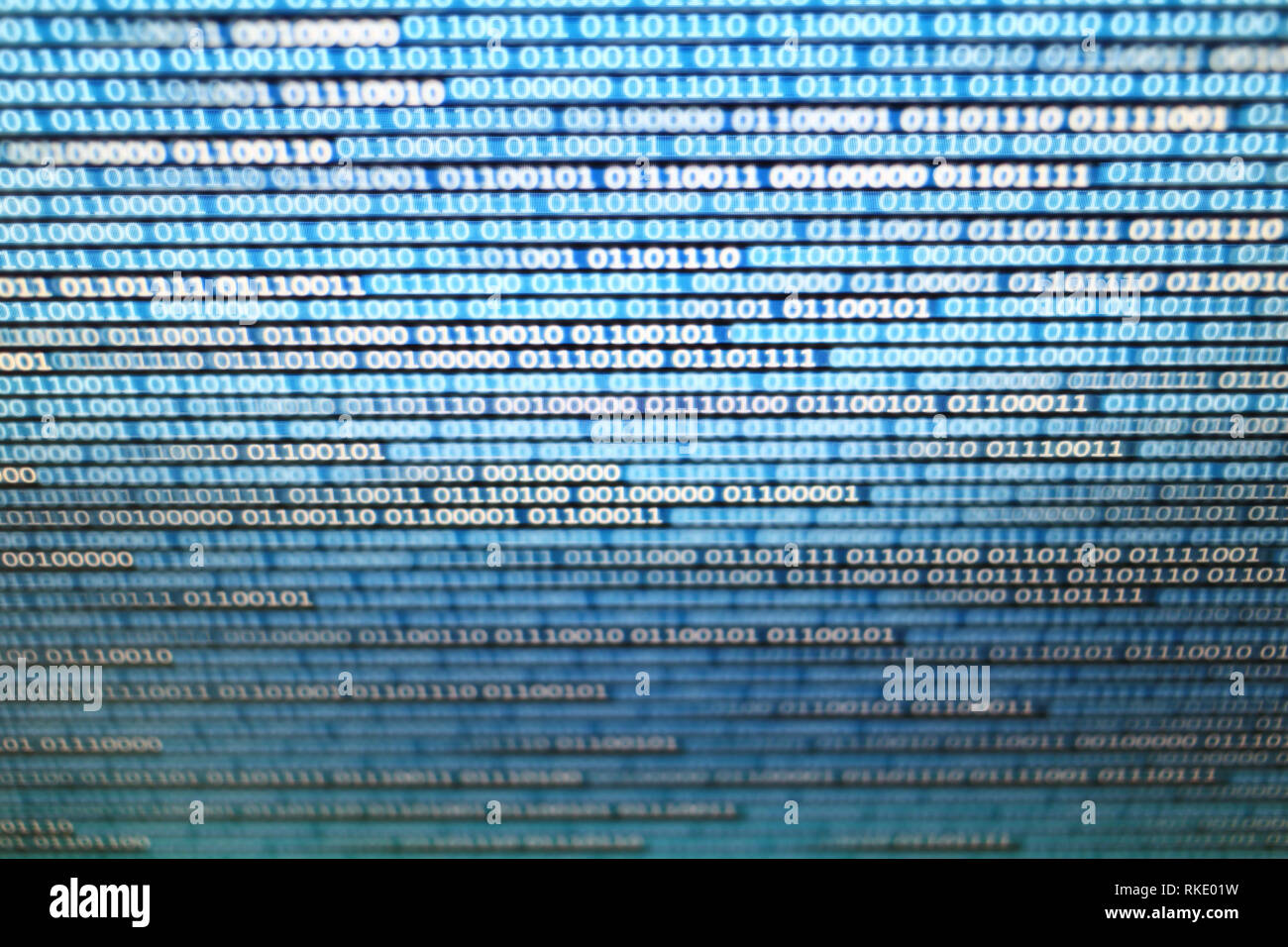 binary data on computer monitor. multiple layers of codes streaming signifying transferring information over internet medium. Stock Photo