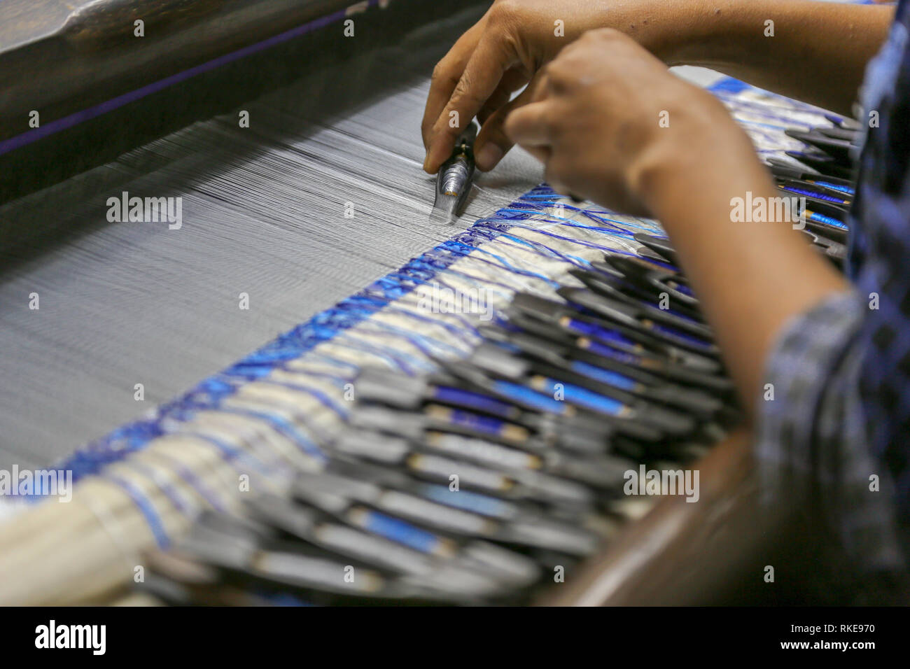 silk weaving and weaving hands, Myanmar Stock Photo