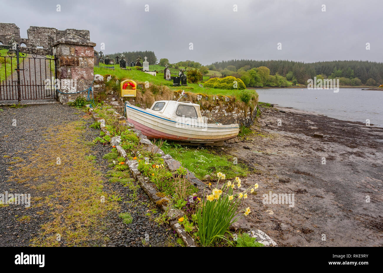 waterside scenery showing a old graveyard seen in Connemara, a region in Ireland Stock Photo