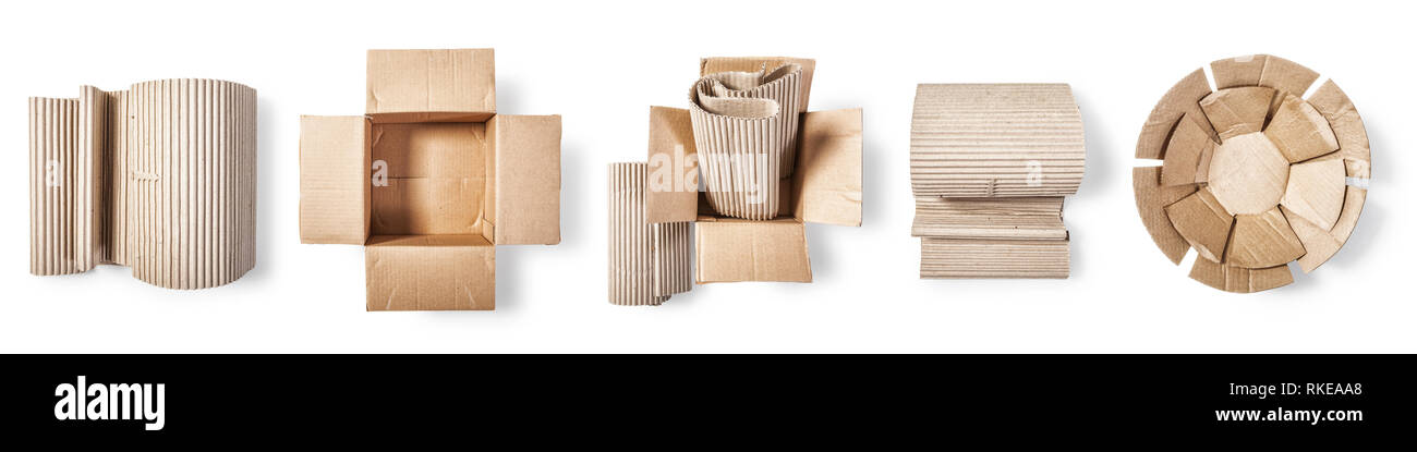 Eco package from recycled paper. Open cardboard box, corrugated role and paper plate. Packaging material collection  isolated on white background. Top Stock Photo