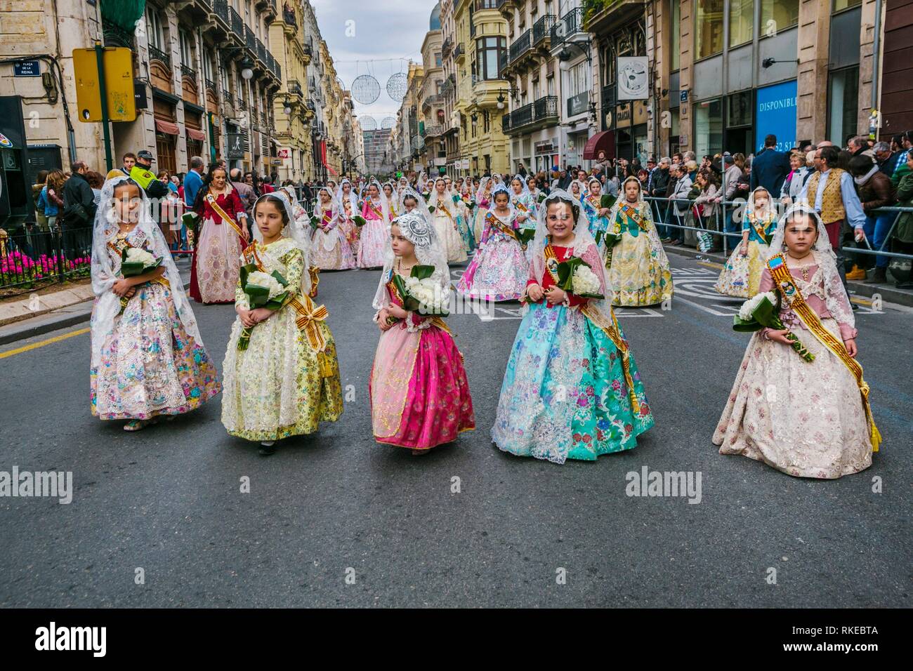 Fallas festival. Falleras. Children in traditional dress. Parade to the Plaza de la Virgin in order to make an offering of flowers to Our Lady of the Stock Photo