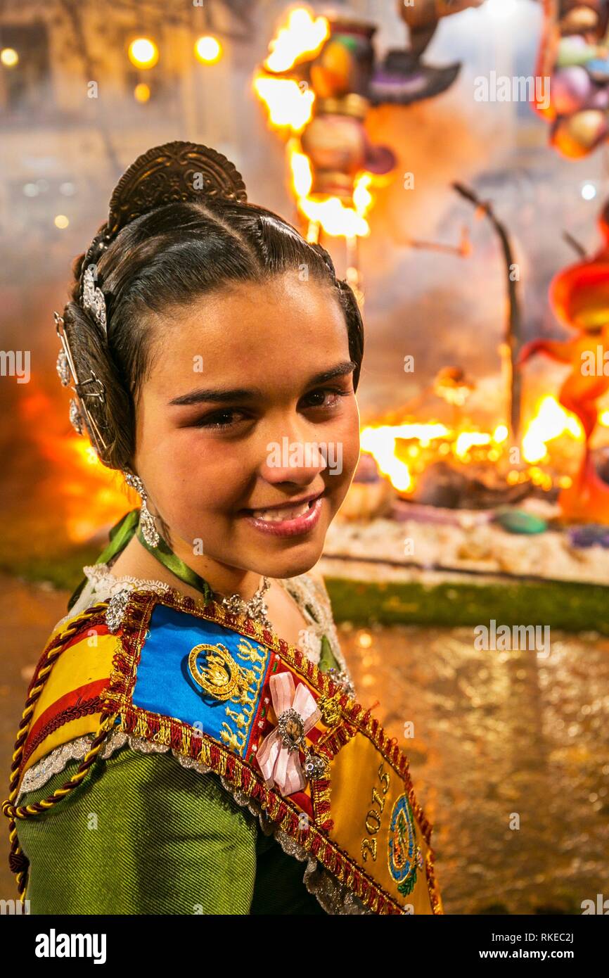 Fallas festival. Fallera. Child in traditional dress. La Crema. The Burning. On 19 March all of the sculptures go up in flames. Burning in the St Stock Photo