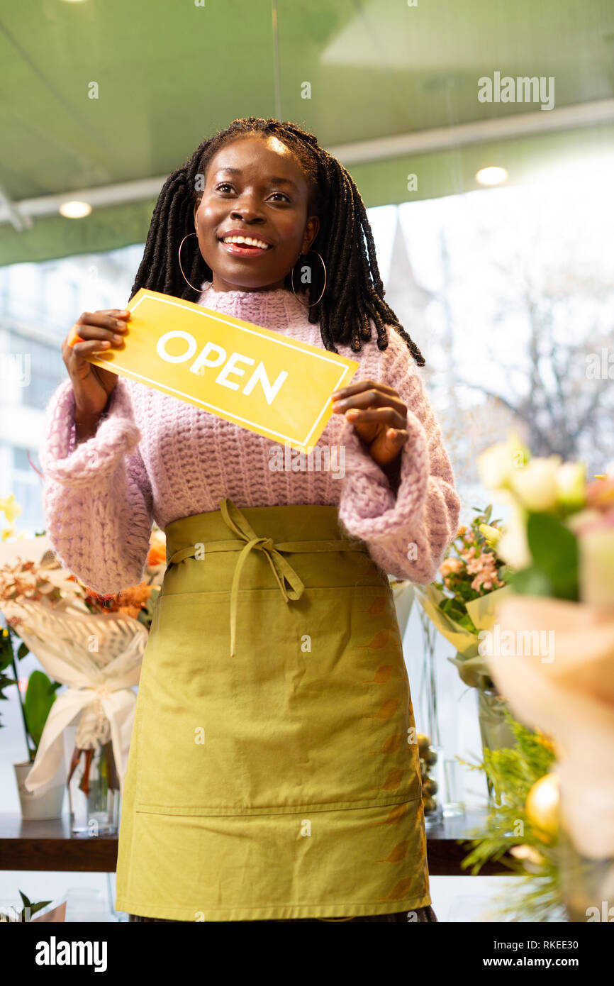 Positive delighted young woman standing in her shop Stock Photo - Alamy