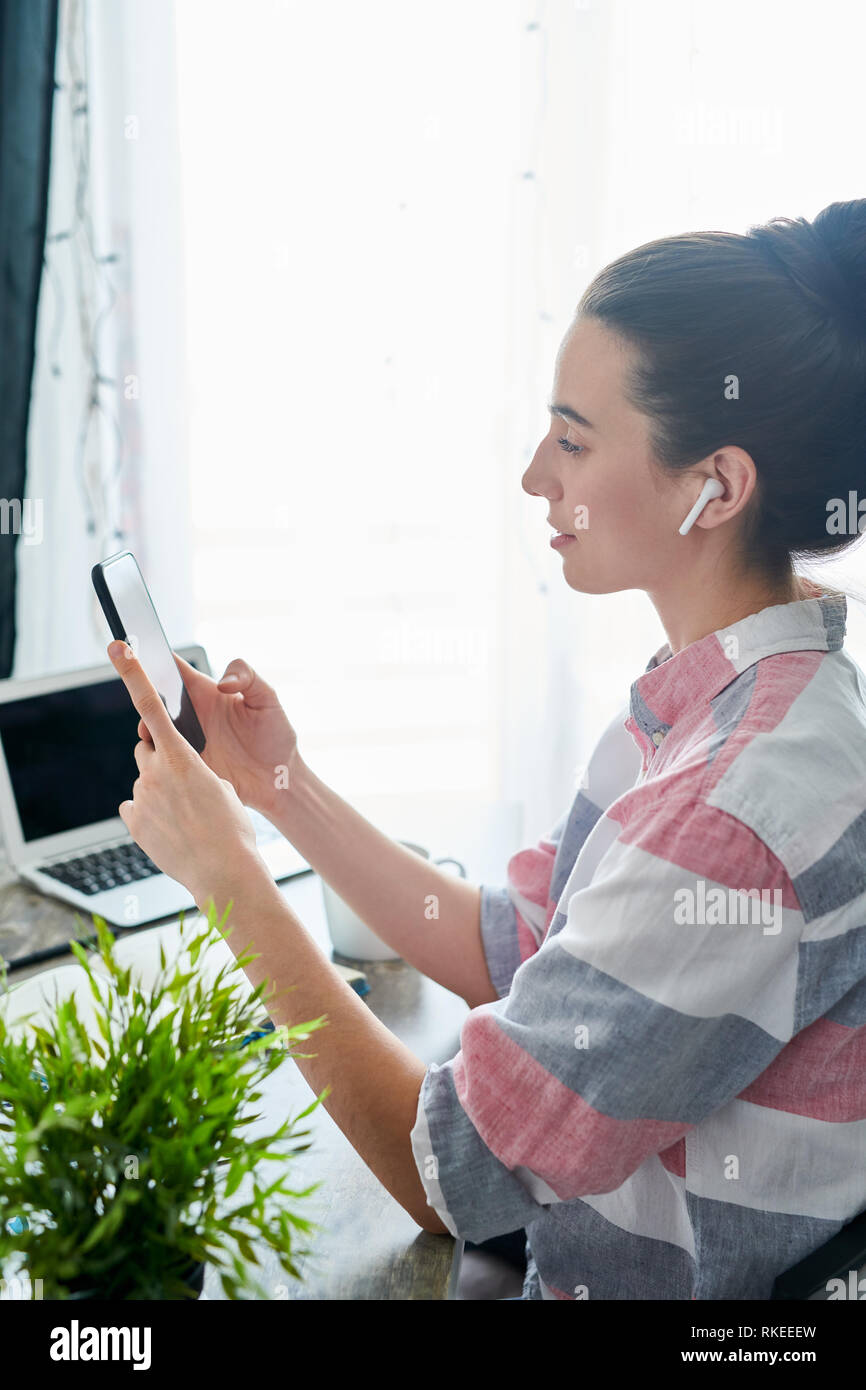 Young Woman Using Mobile Phone Stock Photo