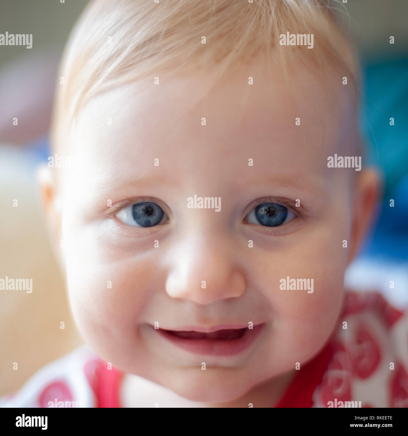Portrait of happy baby with blue eyes Stock Photo