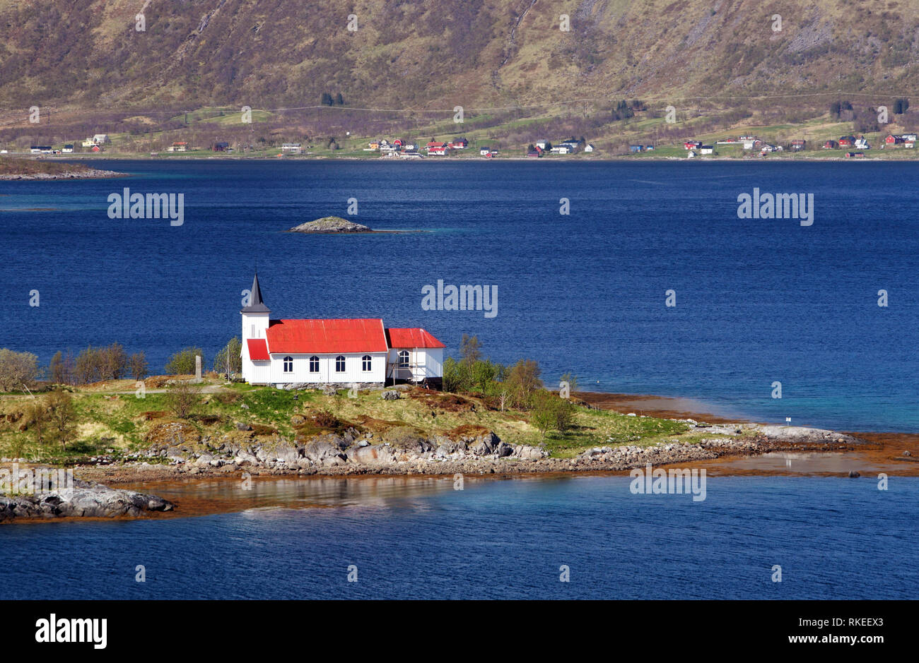 Church in fjord on Lofoten islands in Norway Stock Photo