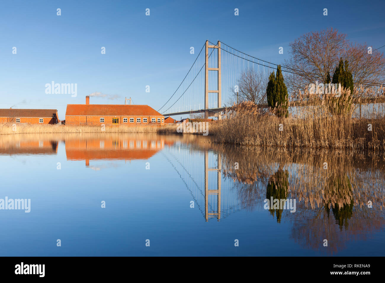 Barton-upon-Humber, Lincolnshire, UK. 11th Feb, 2019. UK Weather: A beautiful blue sky and reflections at The Old Tile Works and Humber Bridge. Barton-upon-Humber, North Lincolnshire, UK. 11th February 2019. Credit: LEE BEEL/Alamy Live News Stock Photo