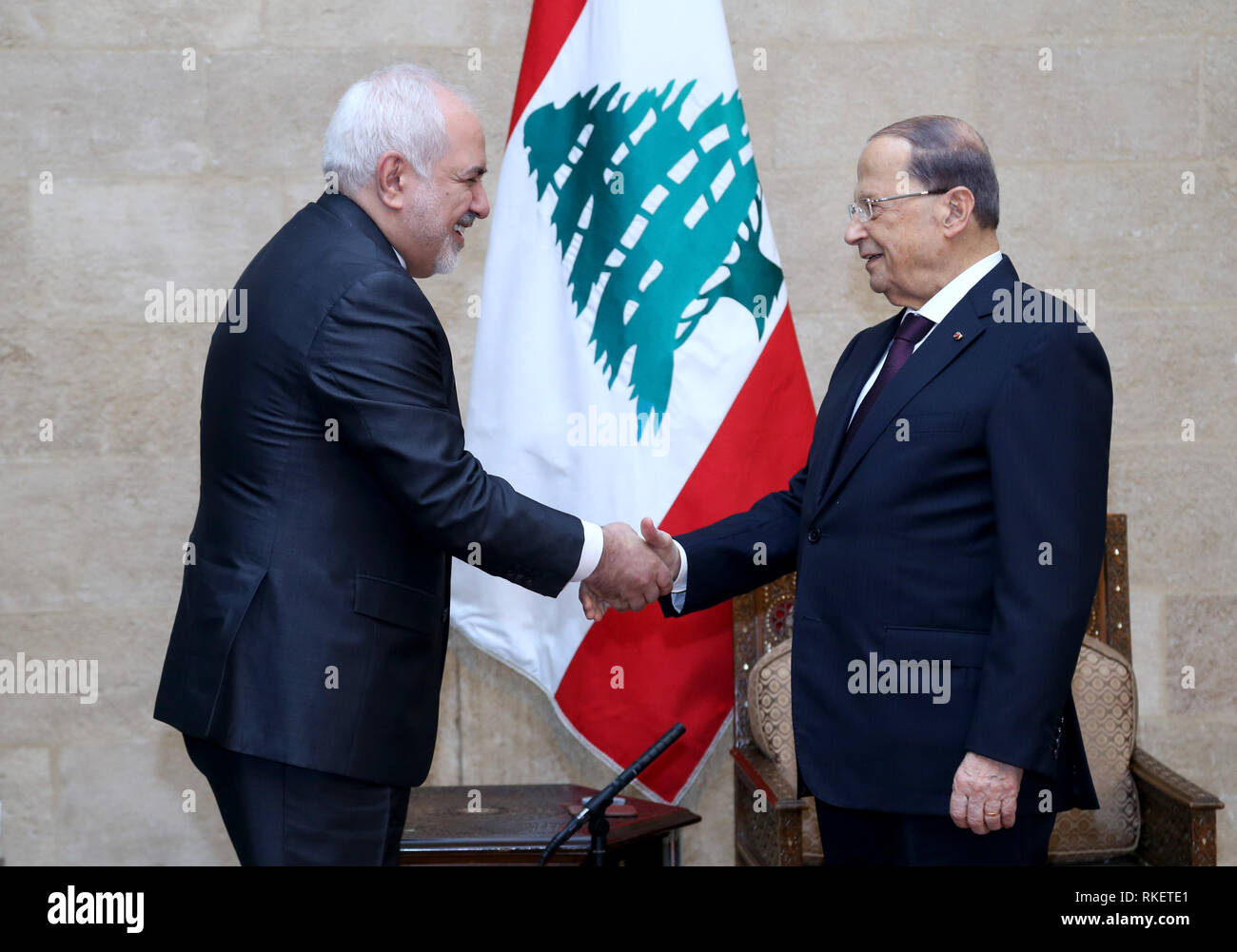 Beirut. 11th Feb, 2019. Lebanese President Michel Aoun (R) shakes hands with visiting Iranian Foreign Minister Mohammad Javad Zarif in Beirut, Lebanon, Feb. 11, 2019. Credit: Xinhua/Alamy Live News Stock Photo