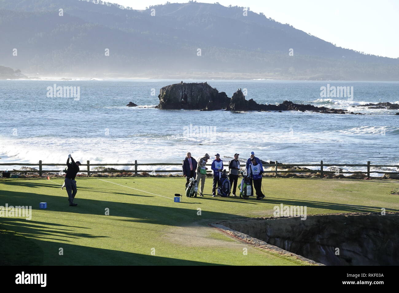 Pebble Beach Golf Links, California, USA. 11th February, 2019  Pebble Beach Golf Links, CA, USA Phil Mickleson drives on the 18th tee watched by Paul Casey during the Monday finish final round at Pebble Beach Golf Course at  the AT&T Pro-Am at Pebble Beach Credit: Motofoto/Alamy Live News Stock Photo