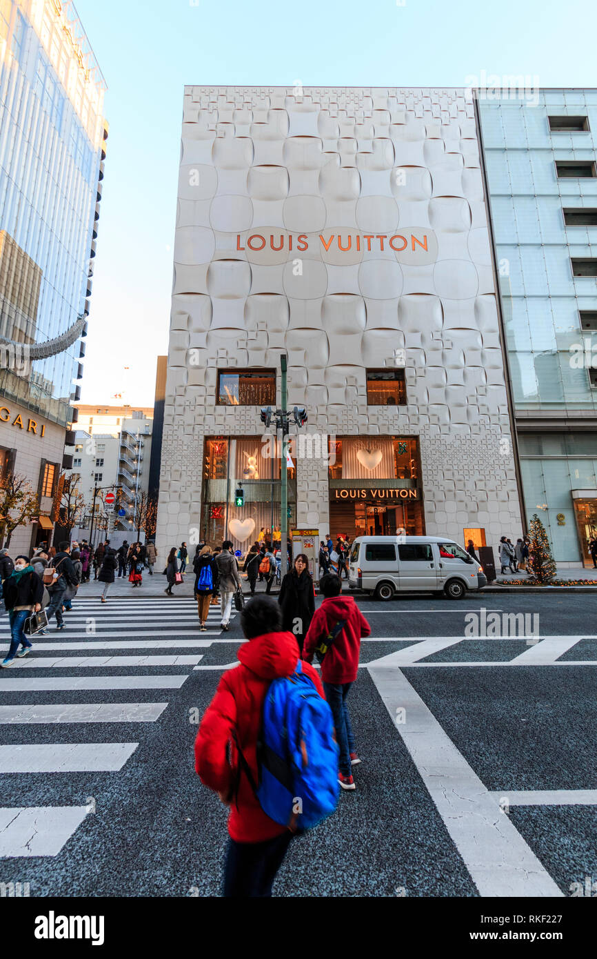 Tokyo, Ginza at golden hour. View along street, Louis Vuitton and
