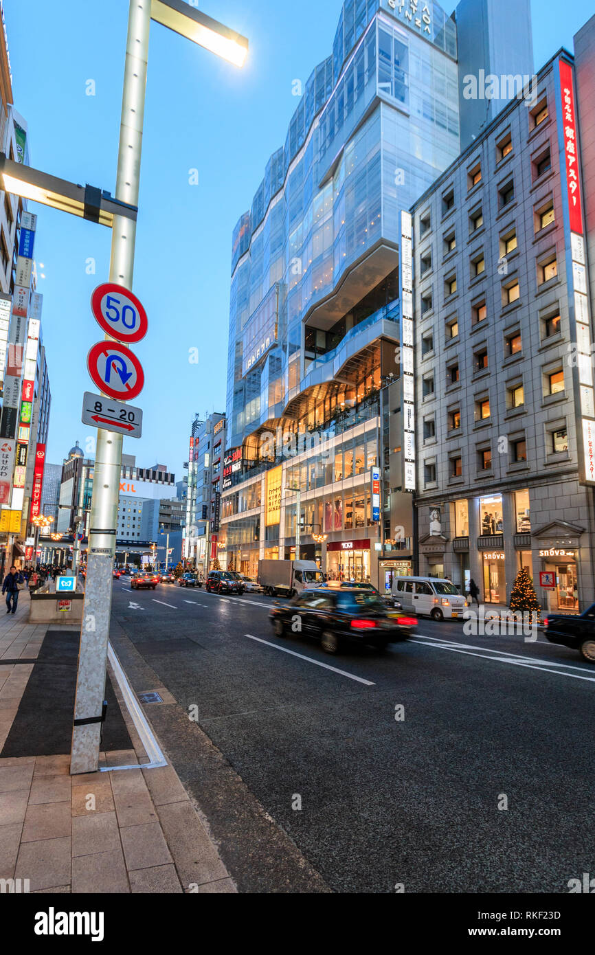 Tokyo, Ginza at golden hour. View along street, Louis Vuitton and the  Bvlgari flagship store buildings with taxis waiting at red stop light in  front Stock Photo - Alamy