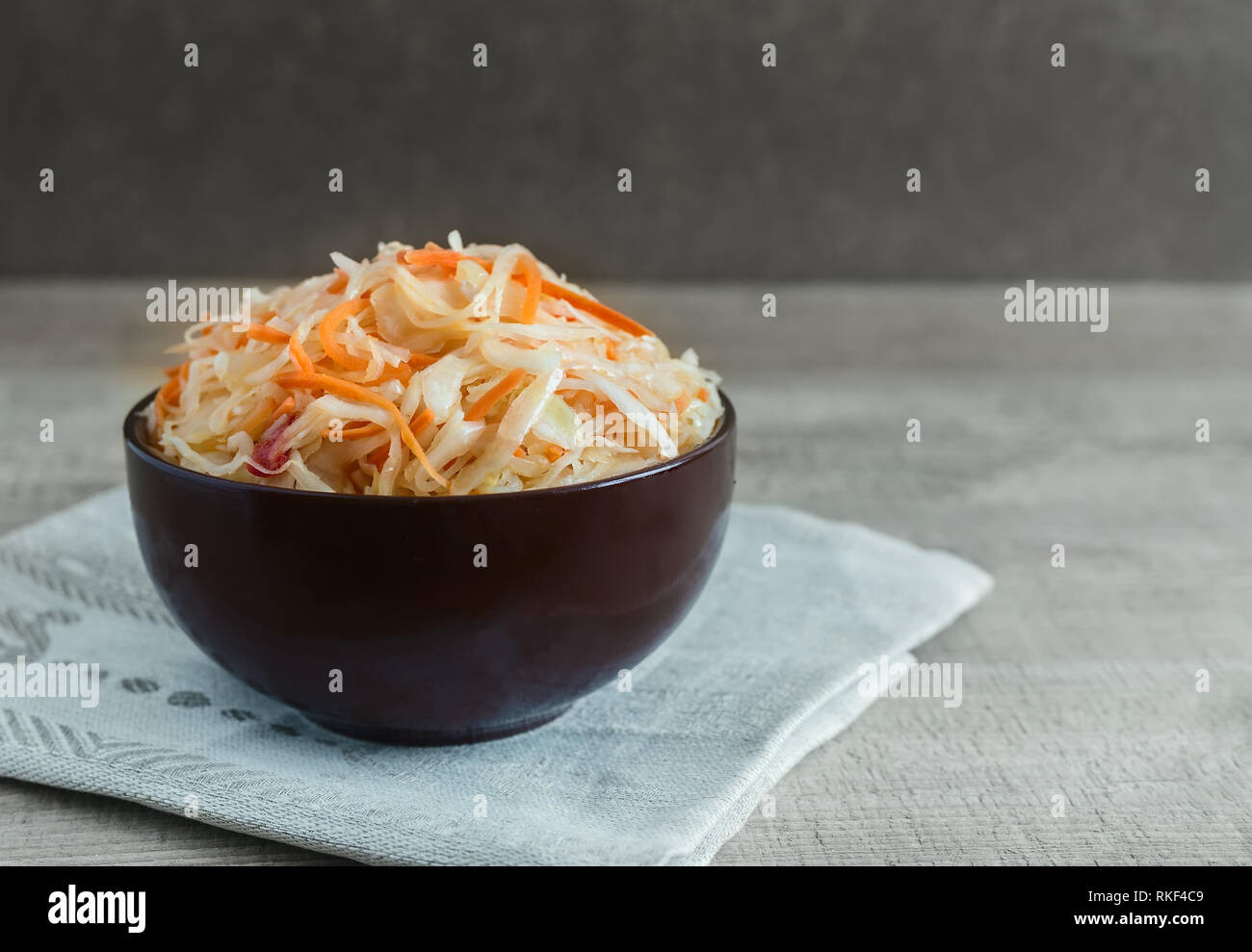 Sauerkraut with carrots in a ceramic Cup. Stock Photo