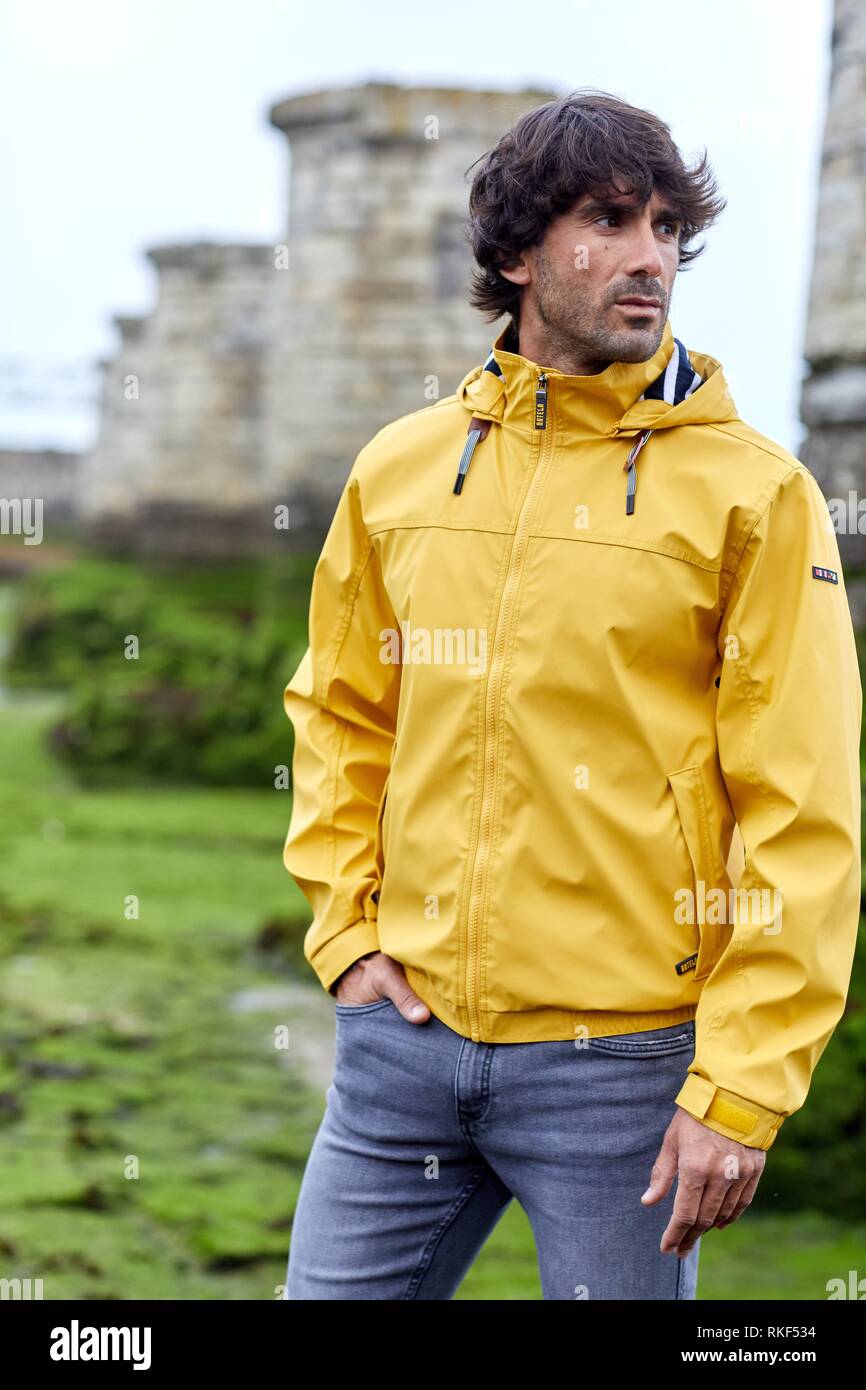 Man with raincoat, Adour river mouth, Anglet, Biarritz, Atlantic Pyrenees, France, Europe Stock Photo