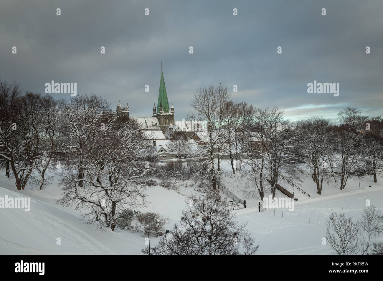 Nidarosdomen Cathedral by Nidelva river in Trondheim. Beautiful wintertime. Most famous gothic, norwegian church. Stock Photo