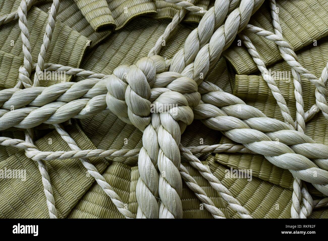 Knotted rope on a sake barrel close up in Jpan. Stock Photo