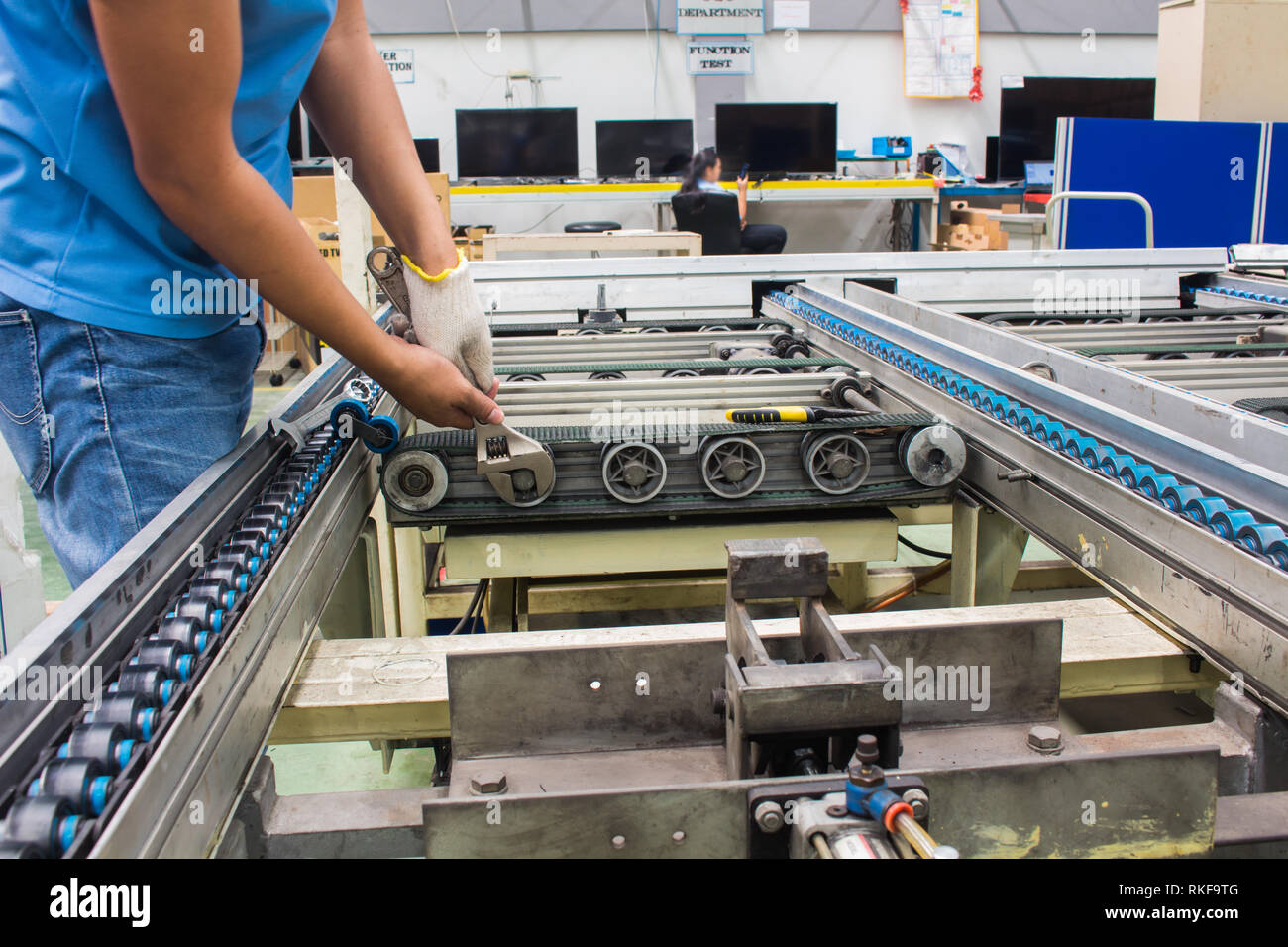 worker maintenance and repair conveyor belt in factory Stock Photo Alamy