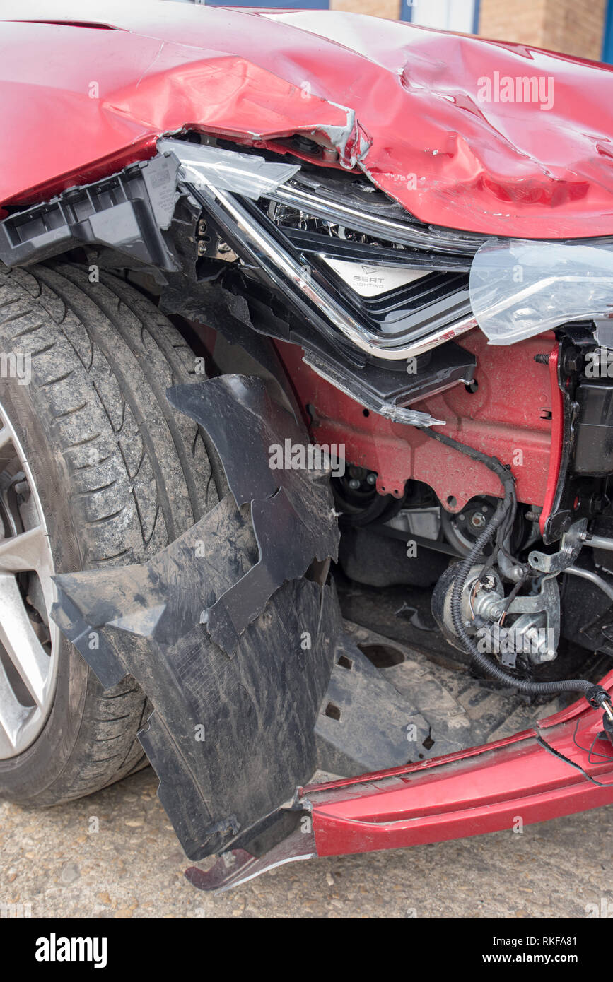 Frontal Car Crash; Red Seat Leon. Headlight and Bumper damage. Stock Photo