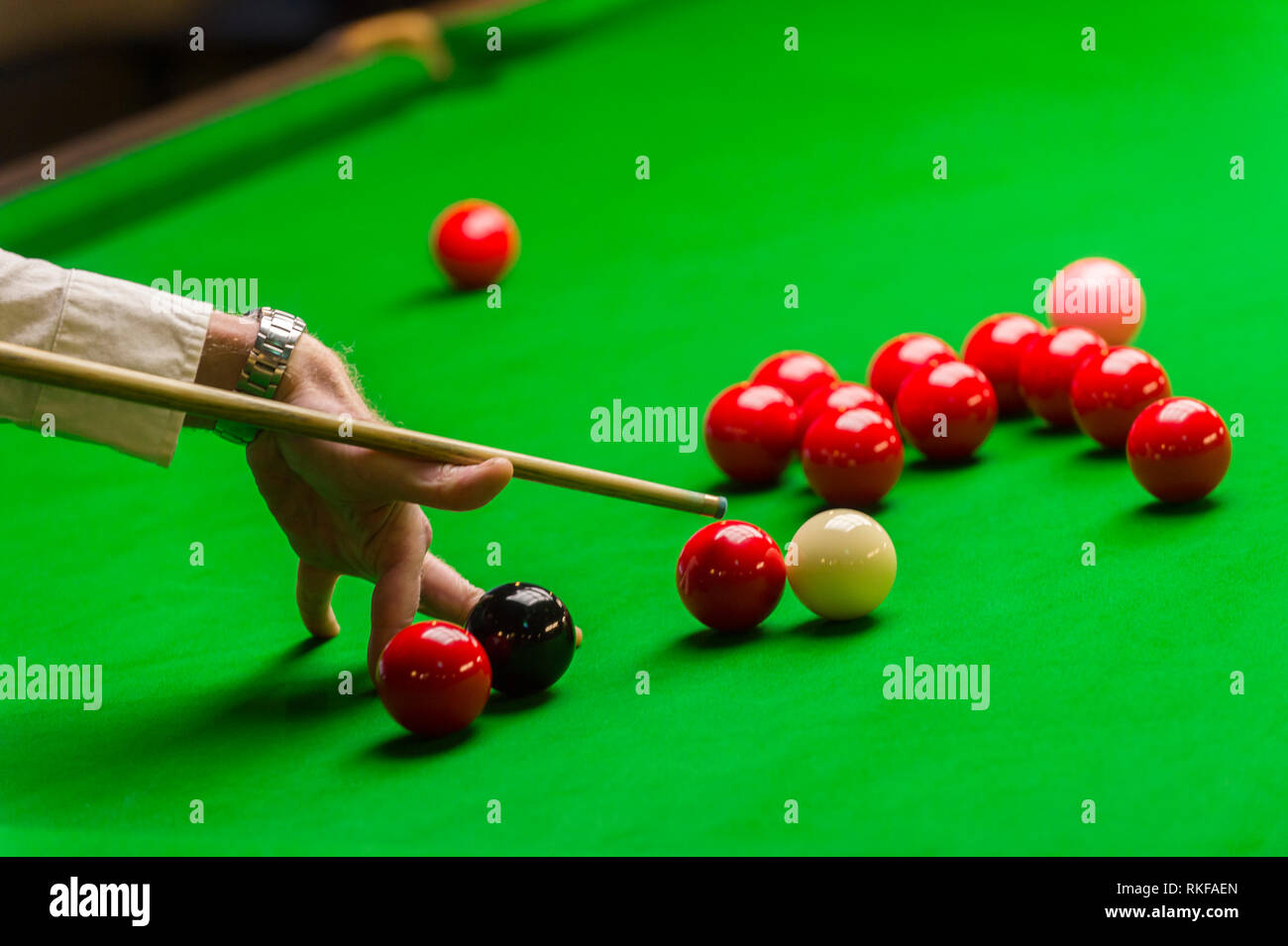 playing snooker - man aiming the cue ball Stock Photo