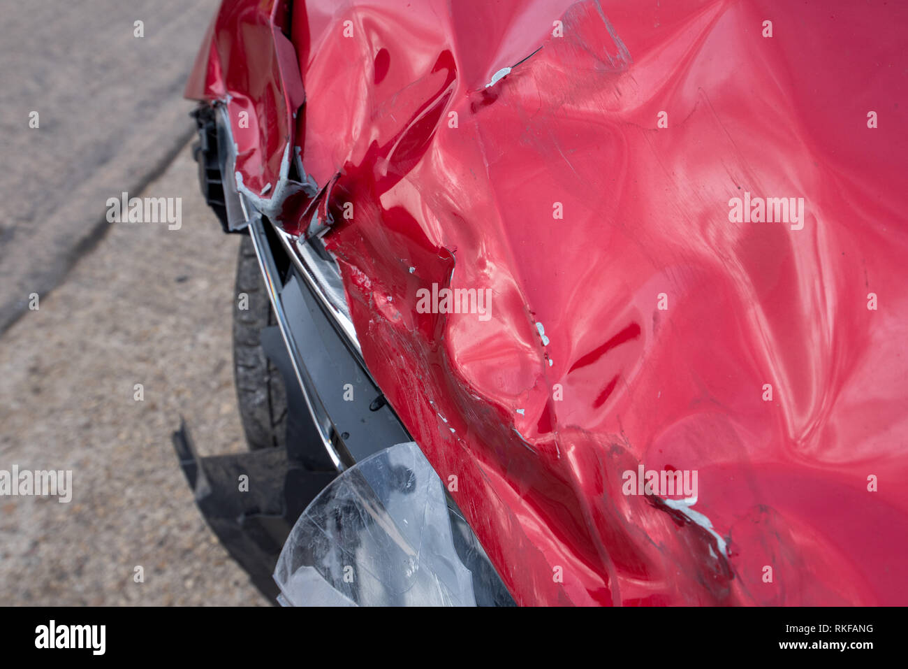 Frontal Car Crash; Red Seat Leon. Headlight and Bumper damage. Stock Photo
