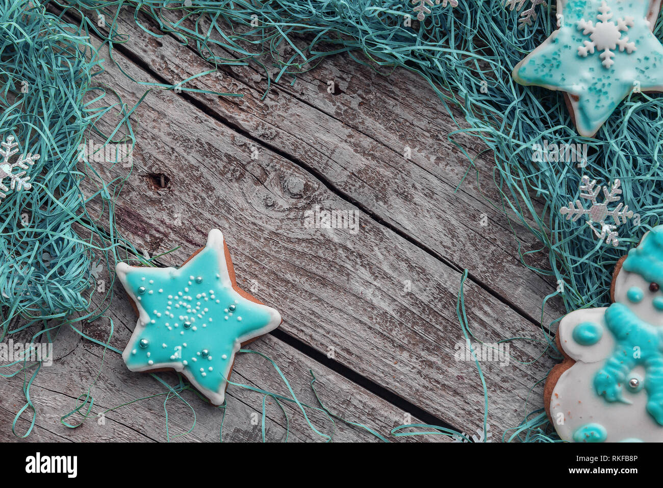 Turquoise star shape with turquoise decorations on gray wood background with copy space. Stock Photo