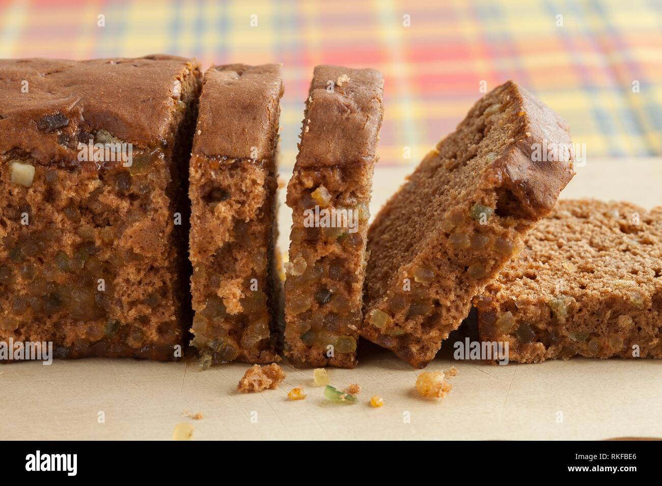 Typical Dutch spice bread with Succade, ginger, cinnamon, nutmeg and cloves made in the province of Friesland sliced close up. Stock Photo