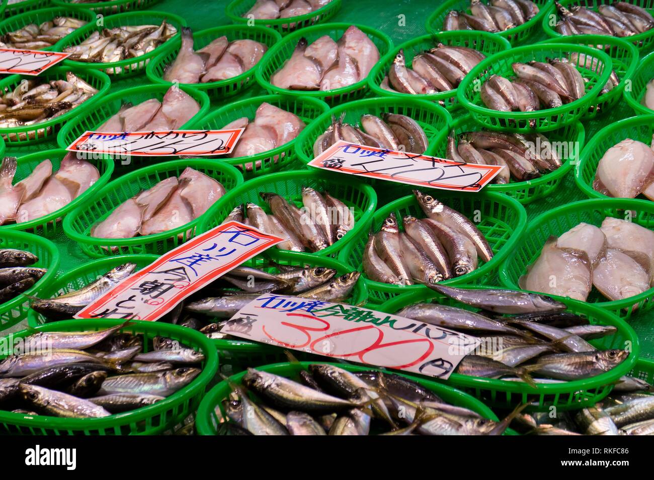 Fresh seafood in green plastic baskets at the Omicho Market. Stock Photo