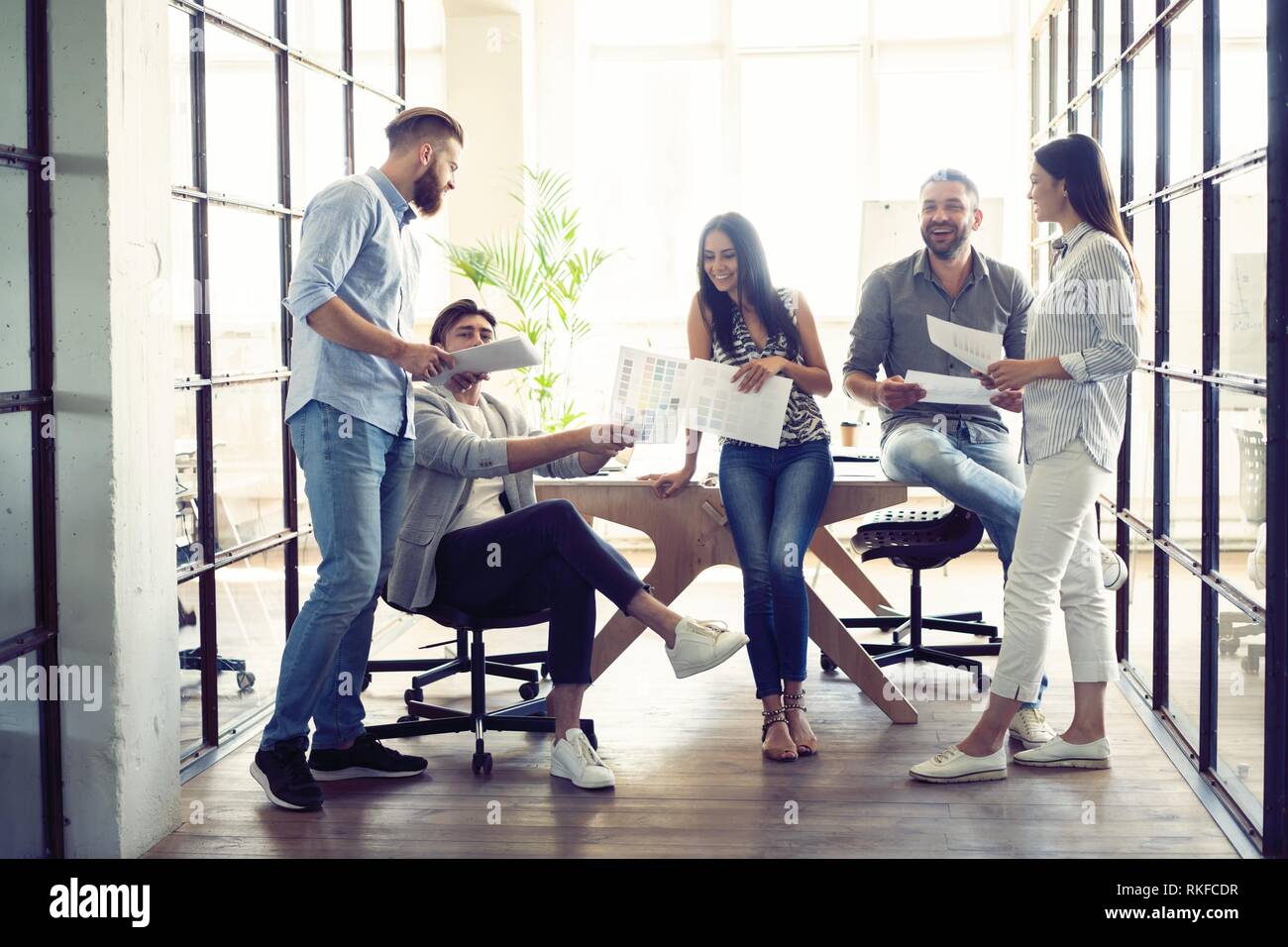 Sharing fresh ideas. Group of young business people in smart casual