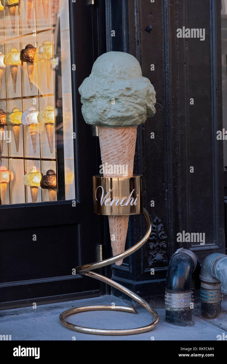 A giant gelato cone sculpture outside  VENCHI, an Italian chocolate & ice cream shop located on Broadway off Union Square Park in Lower Manhattan, NYC Stock Photo