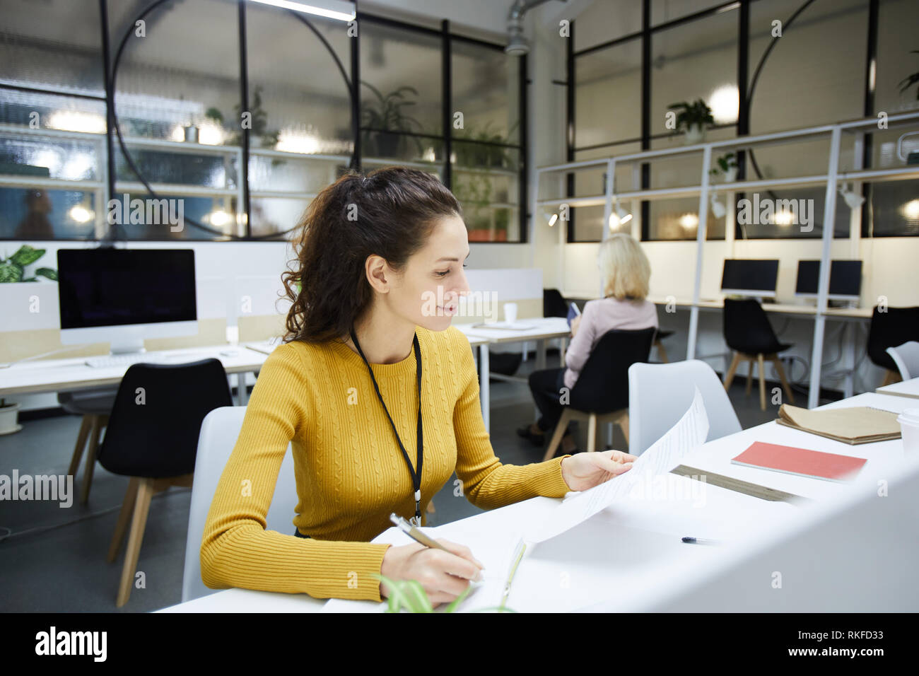 Busy manager checking documents Stock Photo