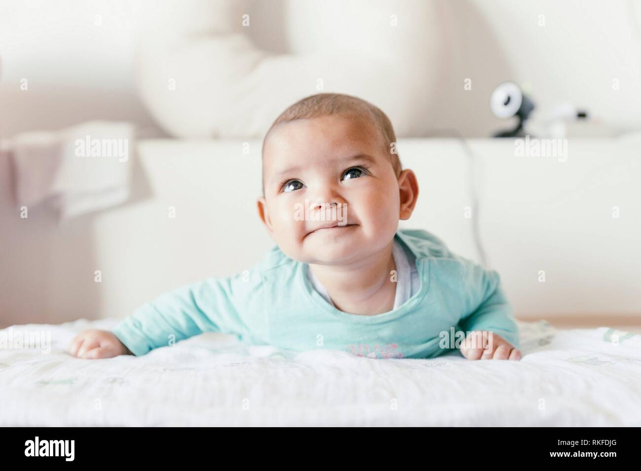 Cute Baby Girl Lying in the Crib. At home Stock Photo Alamy
