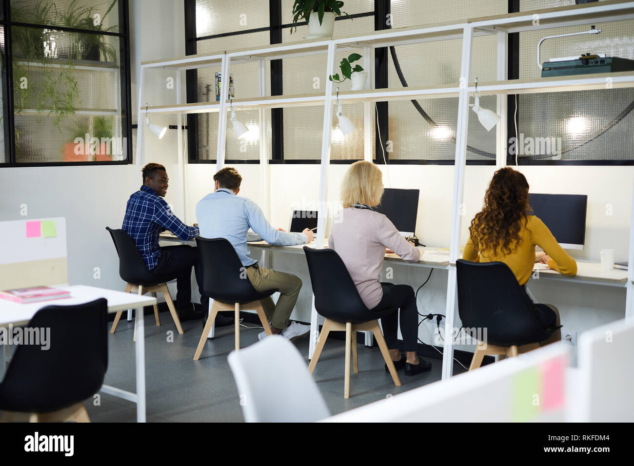 Business people sitting in row Stock Photo - Alamy