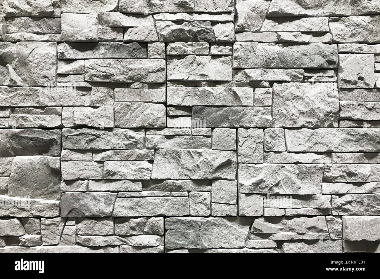 Stone wall with a grey color. Concept interior design background and  texture Stock Photo - Alamy