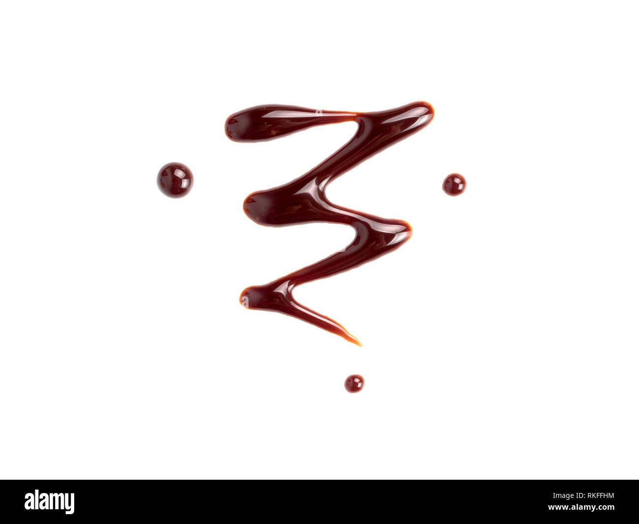 Chocolate sauce on white. Abstract lines made of chocolate or soy sauce