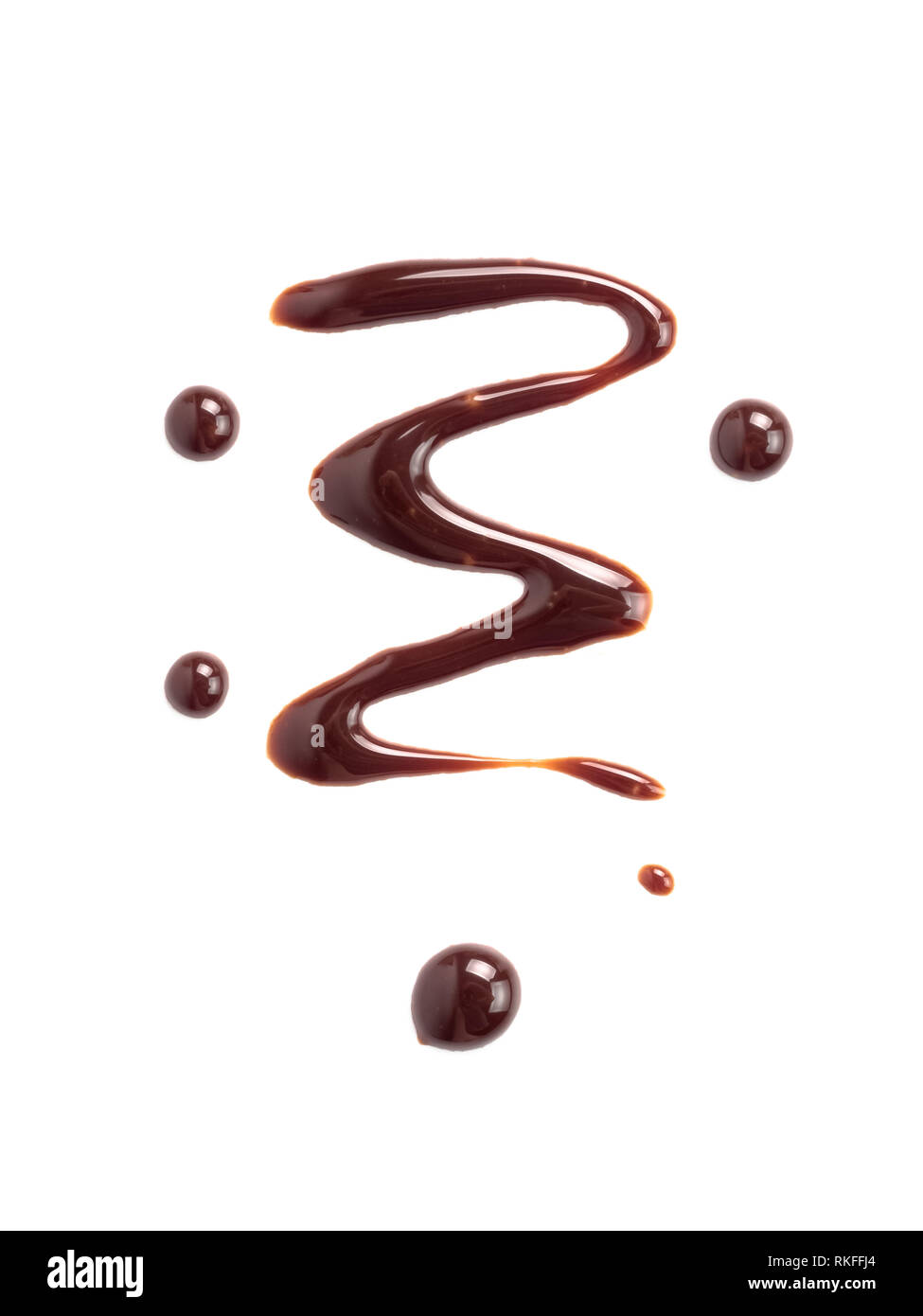 Chocolate sauce on white. Abstract lines made of chocolate or soy sauce