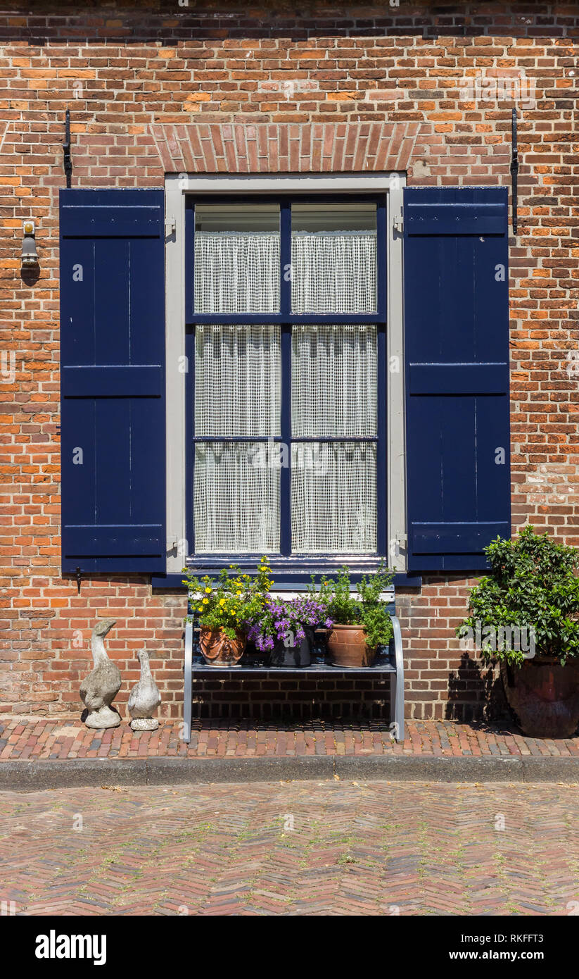 Bench With Flowers In Front Of A Window In Doesburg Holland Stock