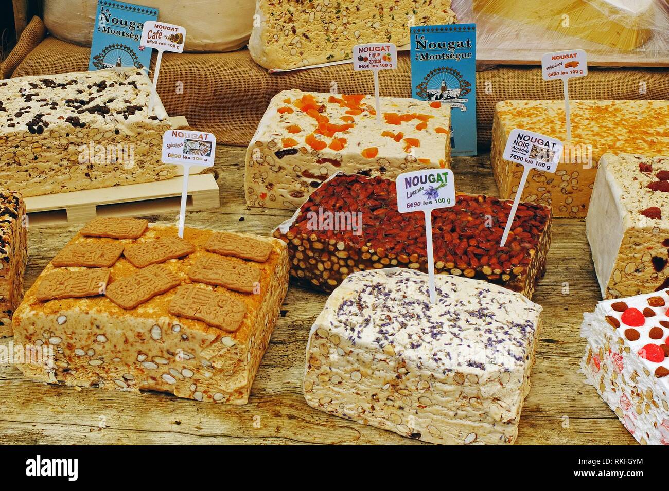 A market booth features artisanal homemade nougats in many flavors, Pezenas, France Stock Photo