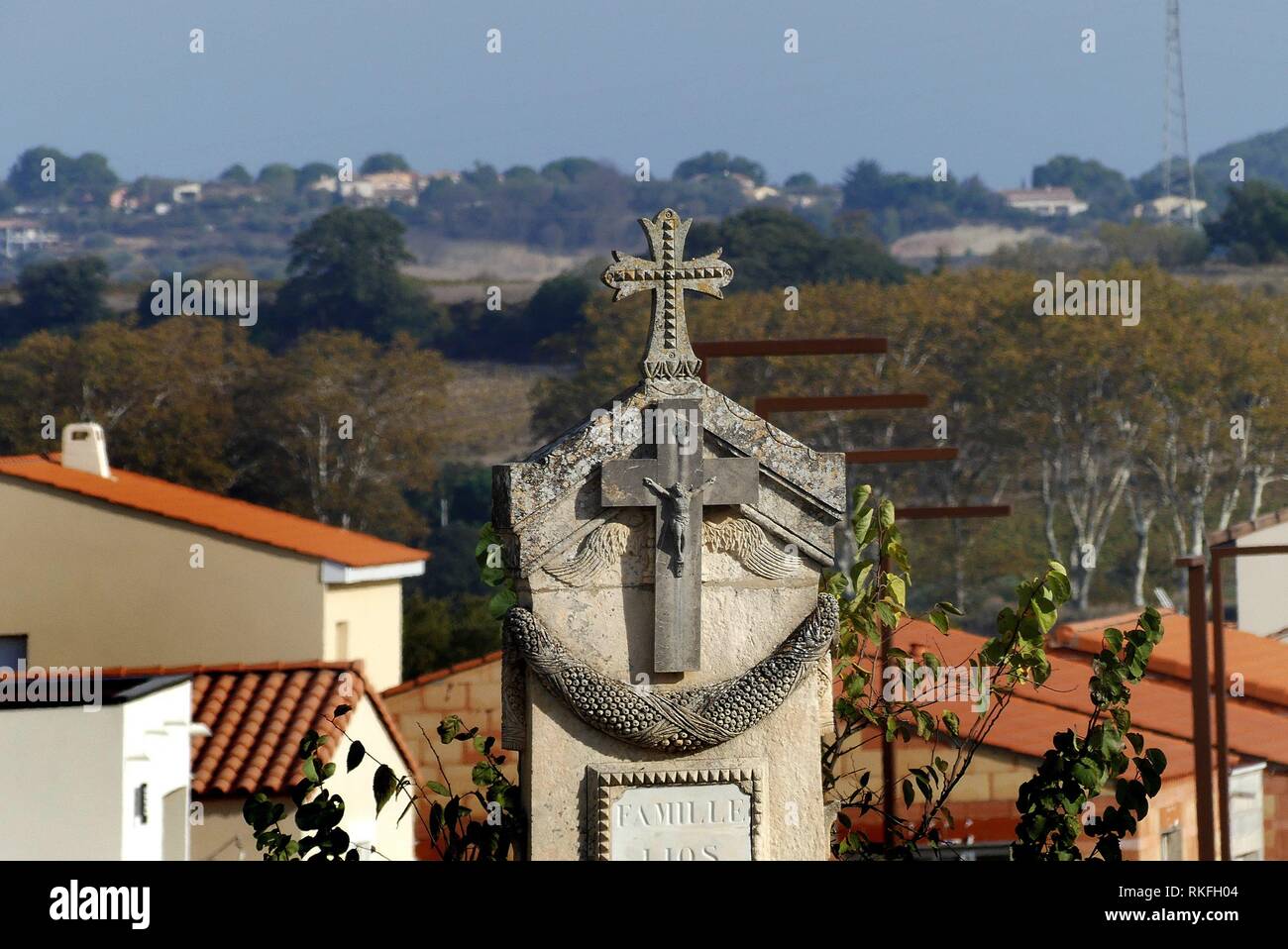 The view from a cemetery of a cross and the Peyne river valley, Pézenas , Herault, France. Stock Photo