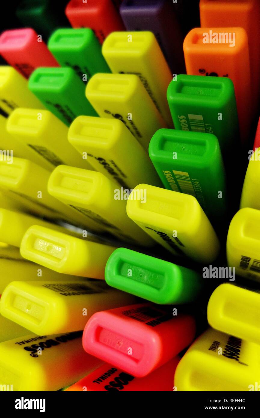 A display of highlighters in various colors for sale in an office