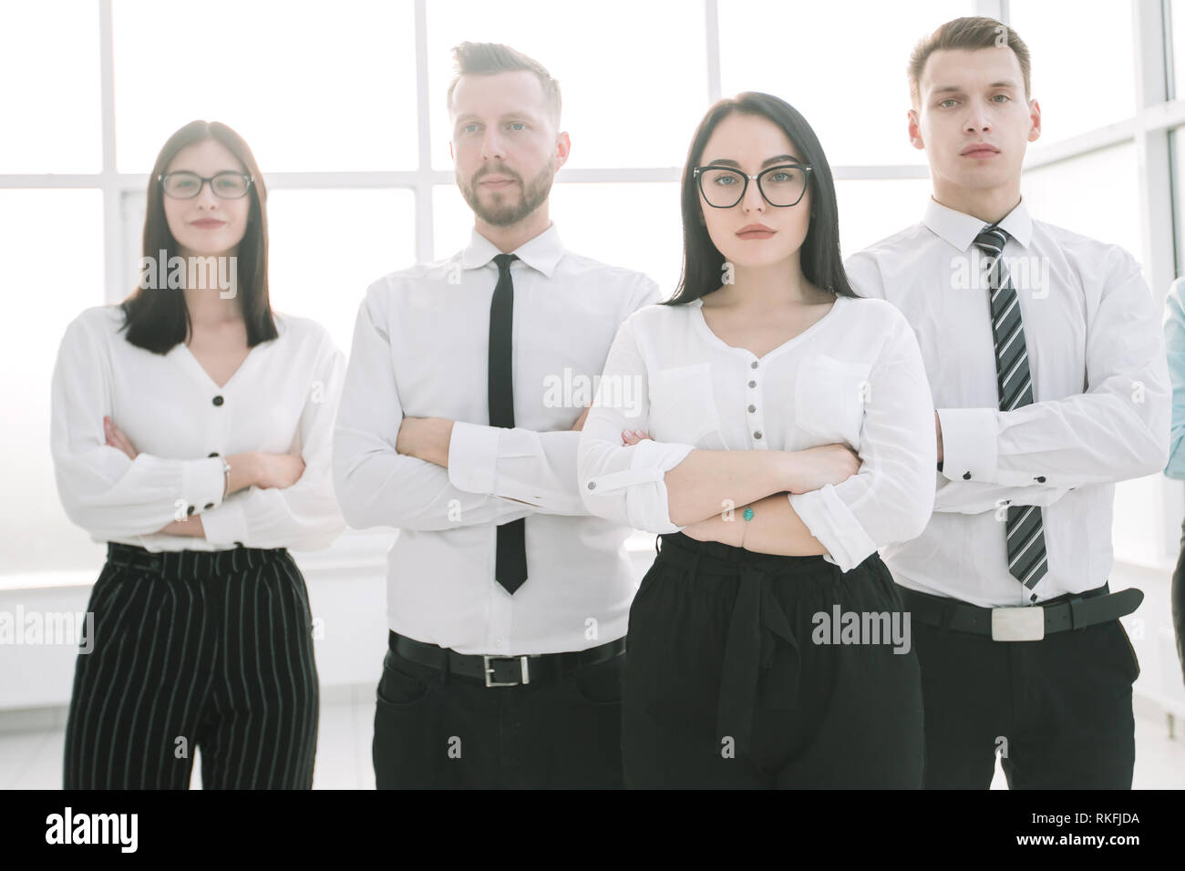 serious businesswoman and her business team standing together Stock ...