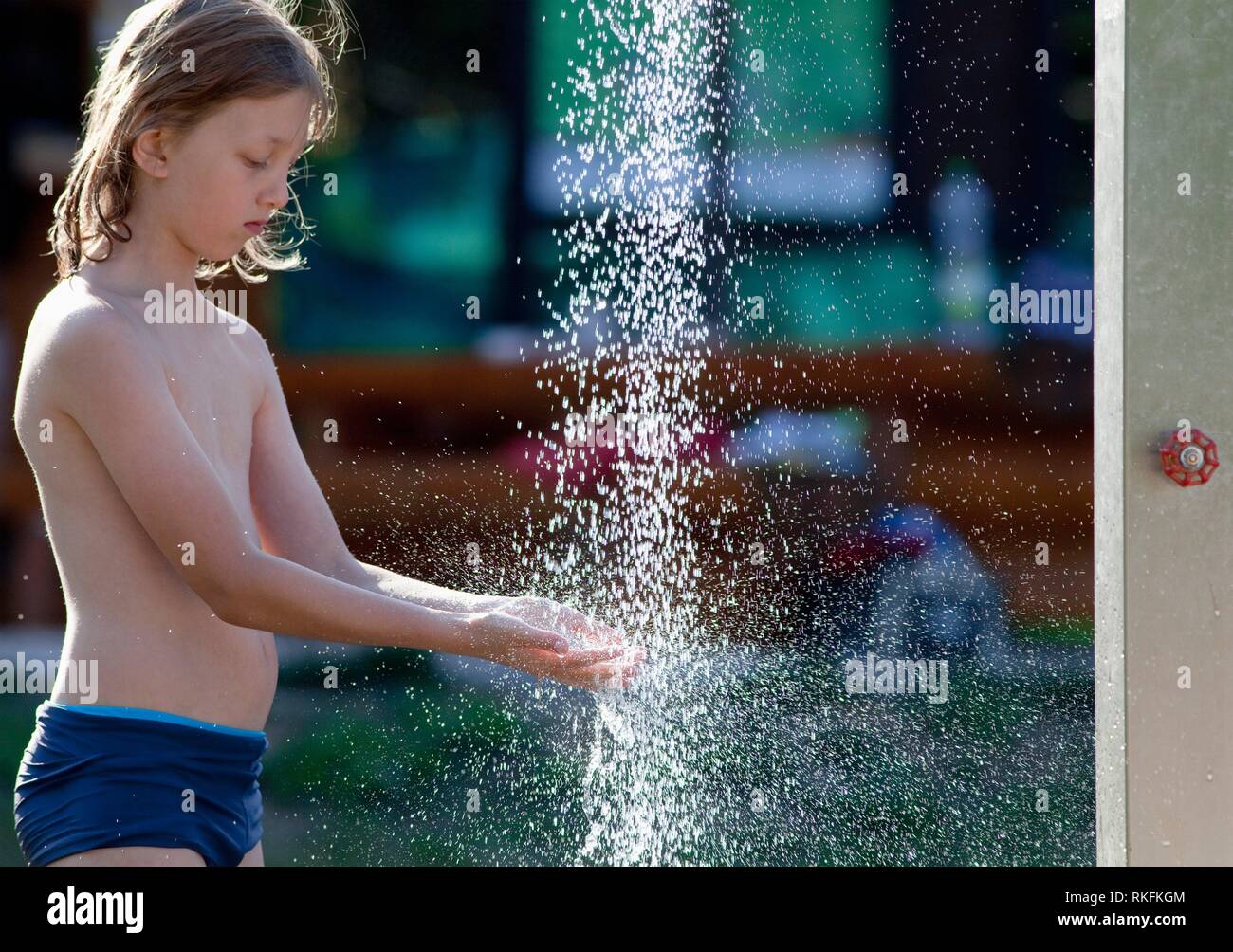 https://c8.alamy.com/comp/RKFKGM/boy-washing-hands-at-outdoor-water-shower-in-summer-RKFKGM.jpg