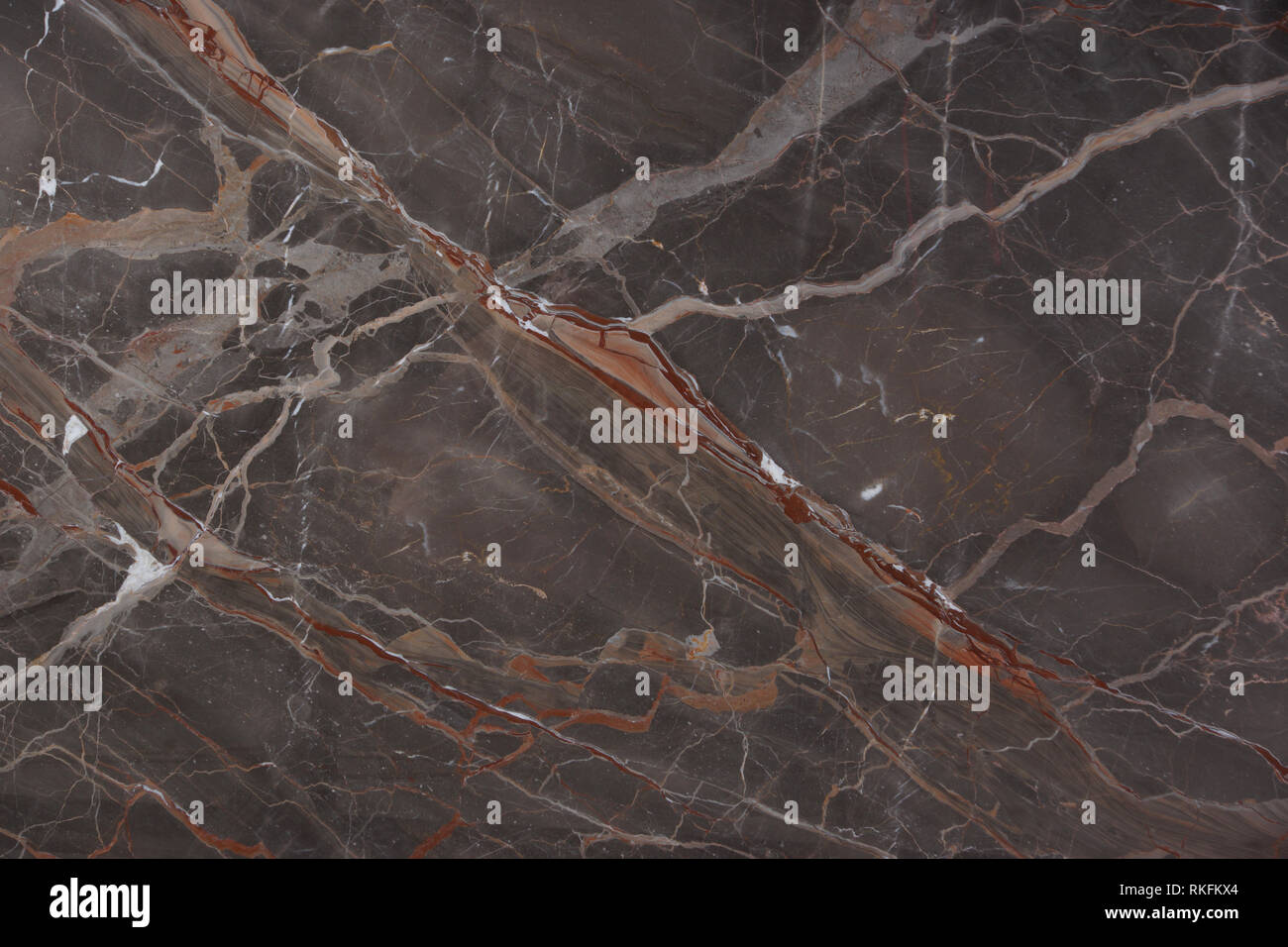 Beautiful brown marble with pink and red veins, called Caravaggio, natural stone, marble texture. Stock Photo