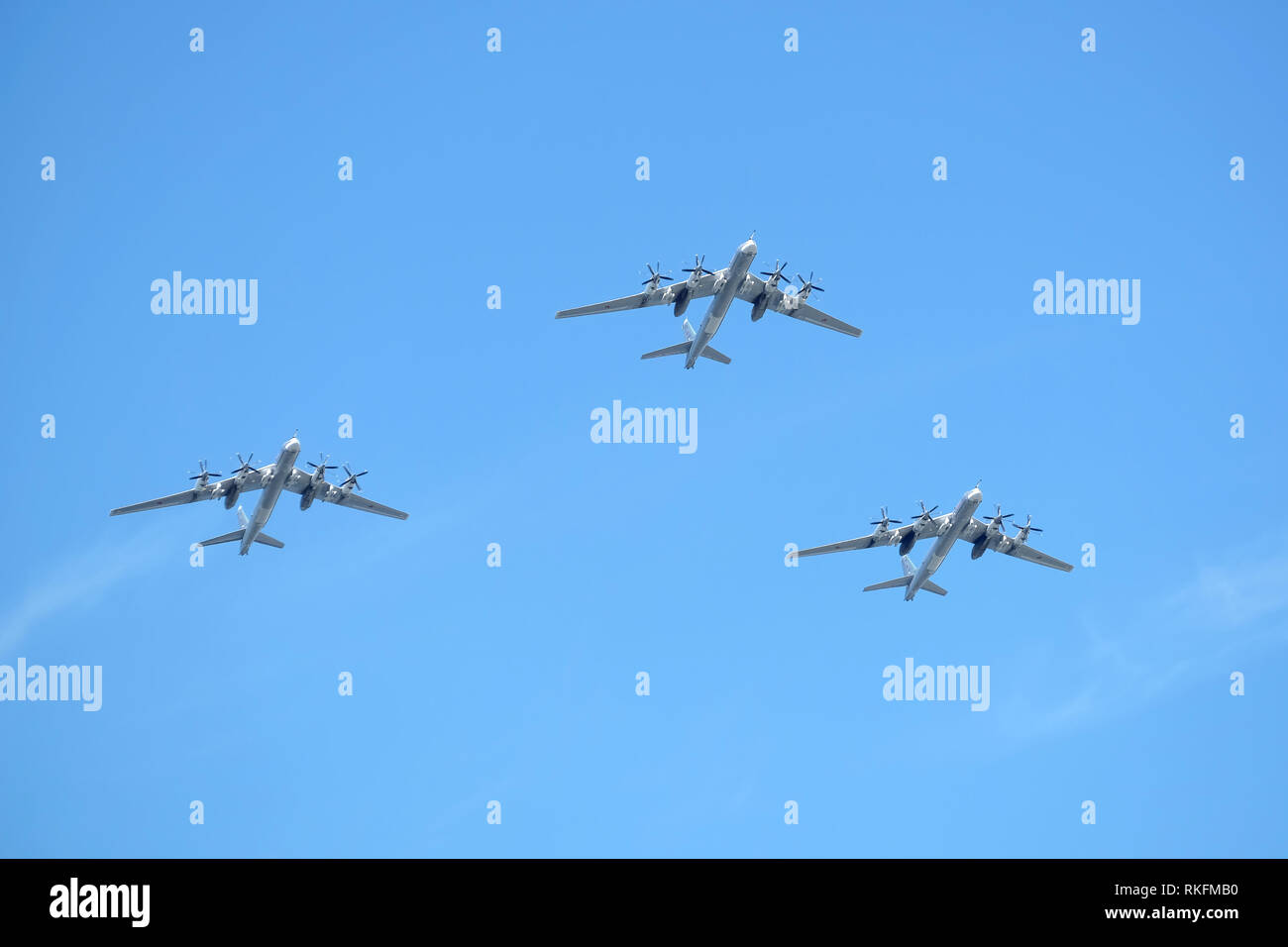 MOSCOW, RUSSIA - MAY 9, 2018: Three Russian military turboprop strategic bombers-missile Tu-95 Bear in flight in blue sky on parade on May 9, 2018 Stock Photo