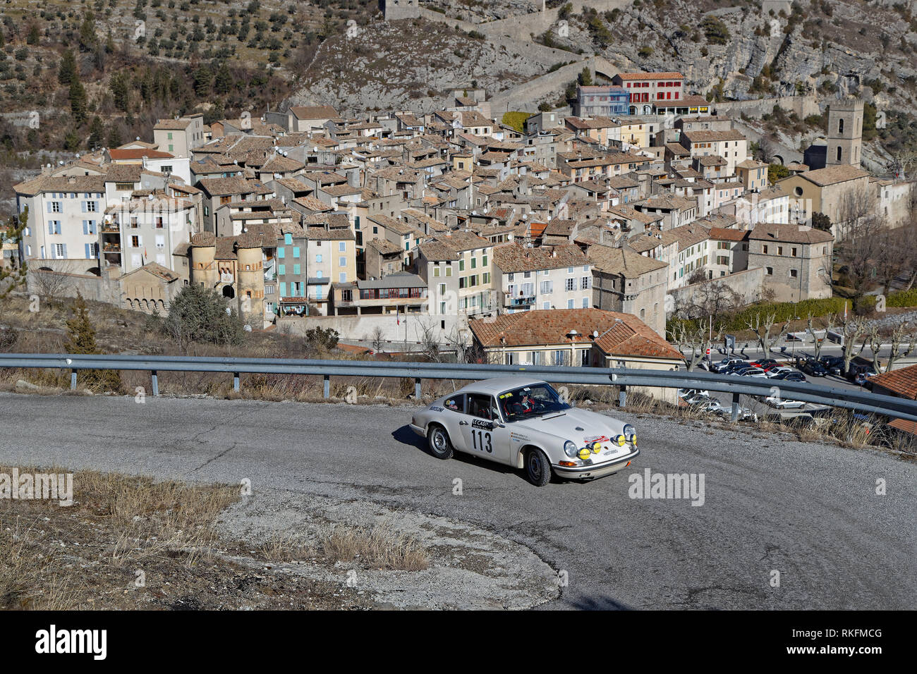 ENTREVAUX, FRANCE, February 5, 2019 : Rally goes trough the medieval village. Rallye Historique is reserved to those cars which have participated in t Stock Photo