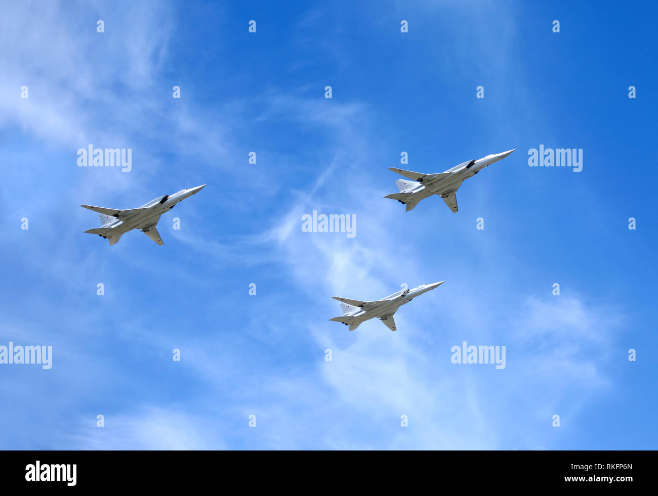 Military aircrafts TU-22M3. Supersonic bombers-missile carriers with variable sweep wing in flight in blue sky on May 9, 2015 in Moscow Stock Photo
