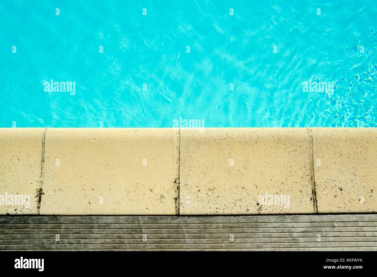 Decking and stone edging detail around a swimming pool Stock Photo Alamy
