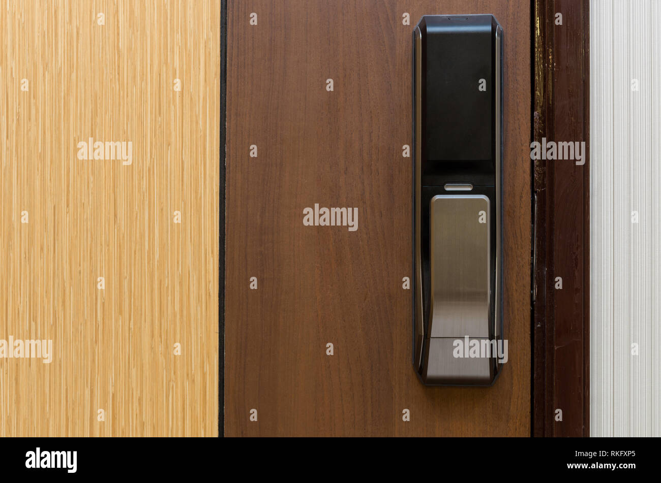 Digital door lock on wooden door Stock Photo