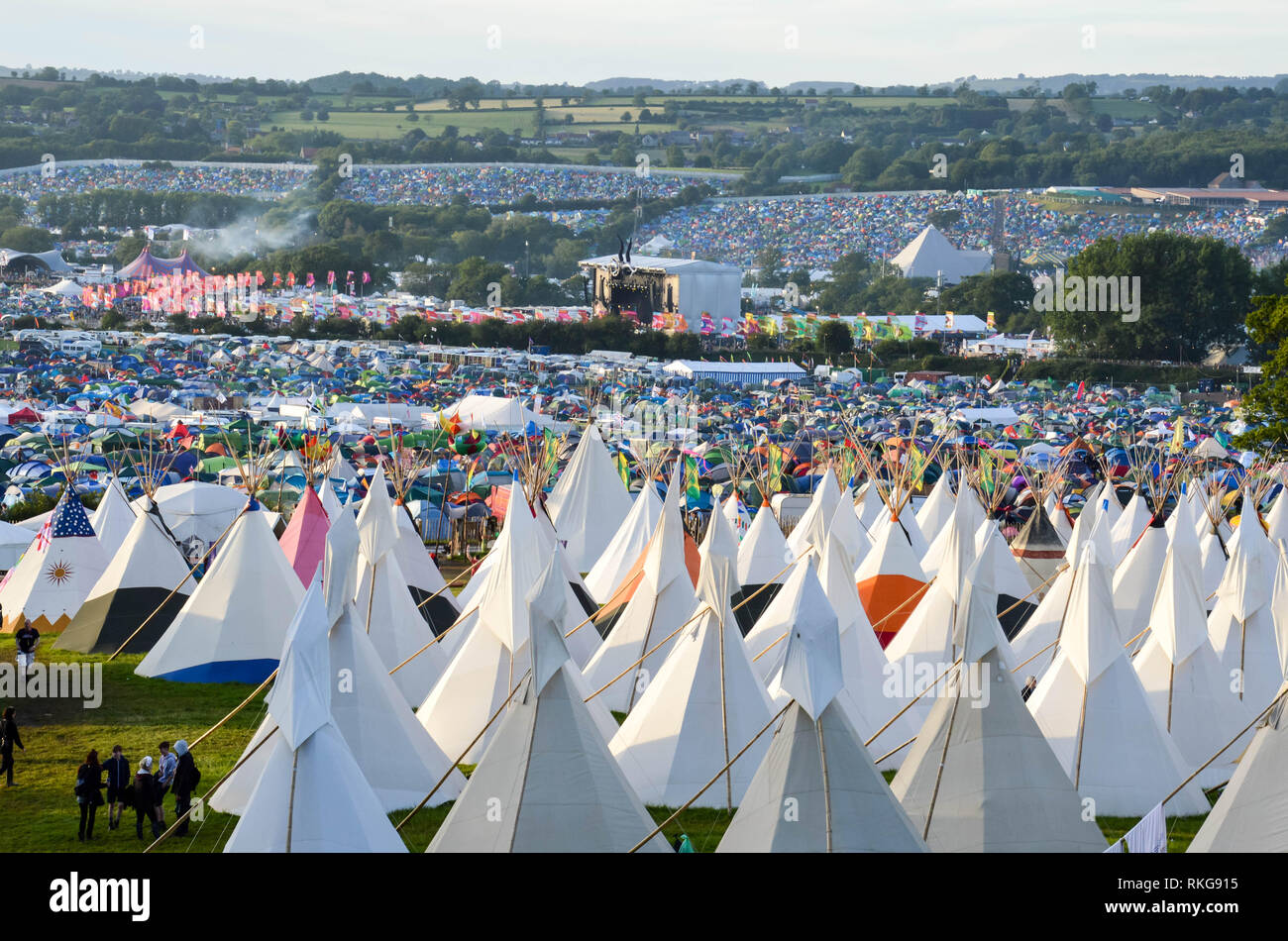 Glastonbury Festival, UK. 06/27/2015. Looking across Glastonbury Festival on a sunny day, With the teepee field in the foreground. Stock Photo