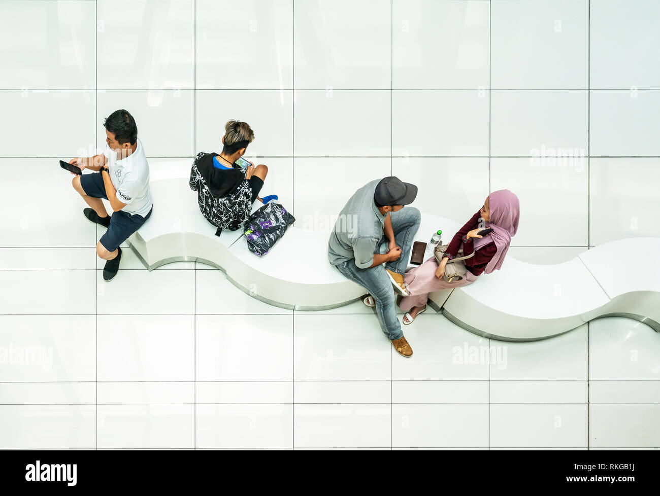 Kuala Lumpur, Malaysia. January 2019.  people sitting in the atrium of the SURIA shopping mall. Stock Photo