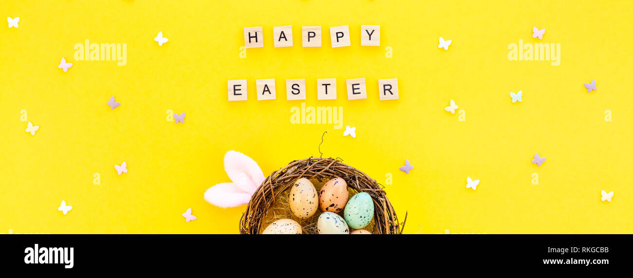 Creative Top view flat lay holiday composition Easter bunny ears eggs ...